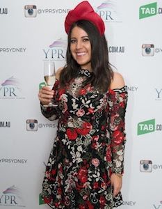 Customer wearing a black and red lace mini Thurley dress for the races.